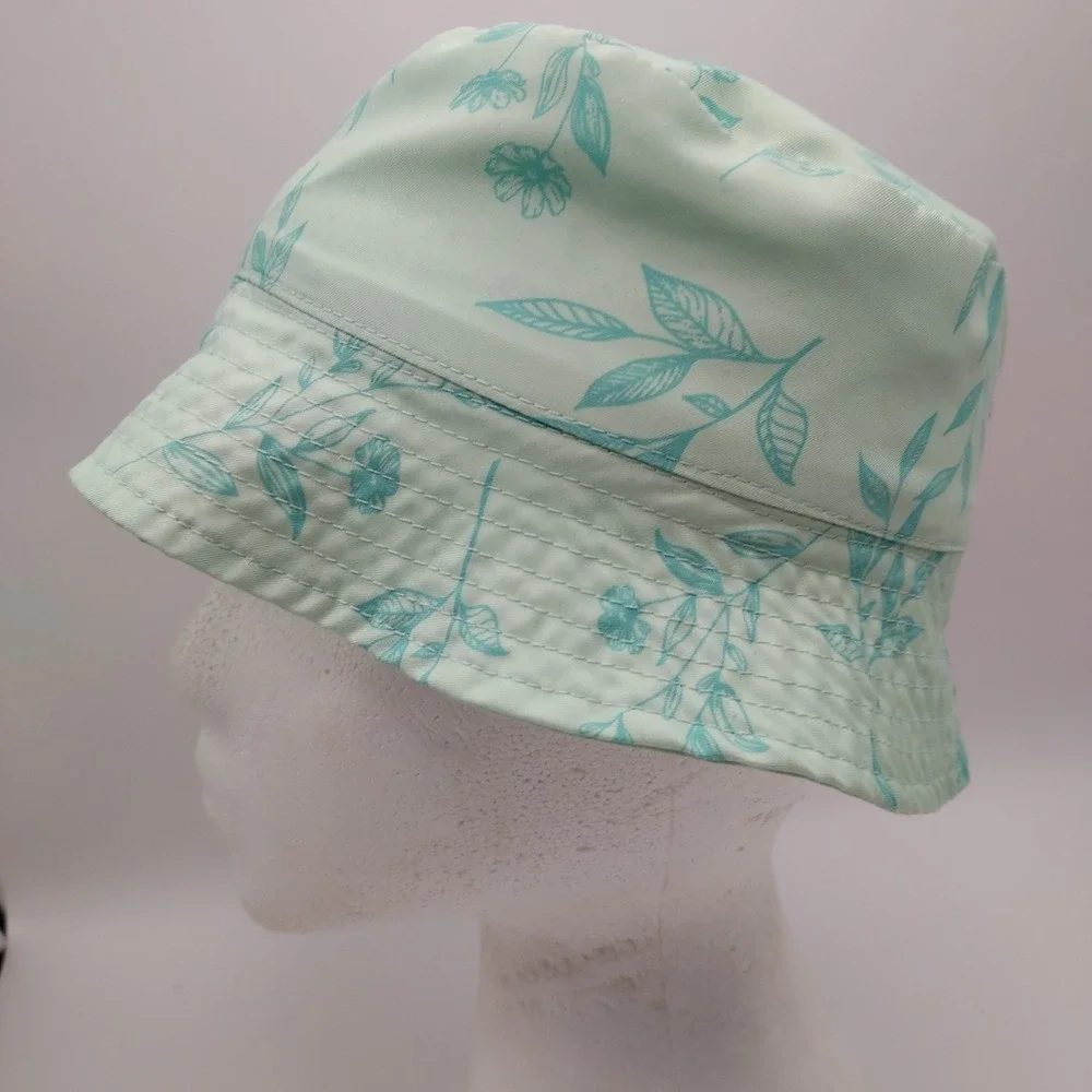 Women's Eddie Bauer floral bucket hat in mint green with aqua blue leaf floral